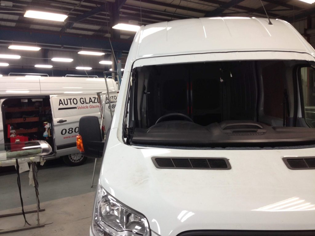 A damaged Van windscreen in the Auto Glazing Uk Ltd workshop